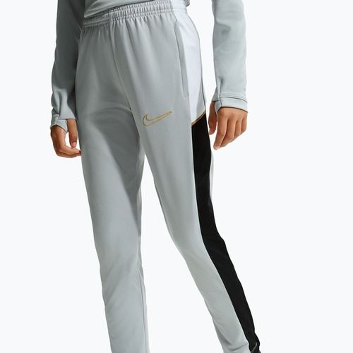 Pantaloni da bambino Nike Academy Dri-Fit Jr light smoke grey/white/black/metallic gold