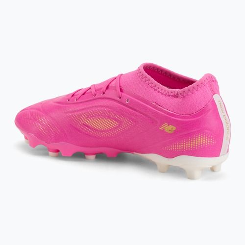 Scarpe da calcio per bambini New Balance Tekela Team V5 pink heat/metallic gold/pink satin
