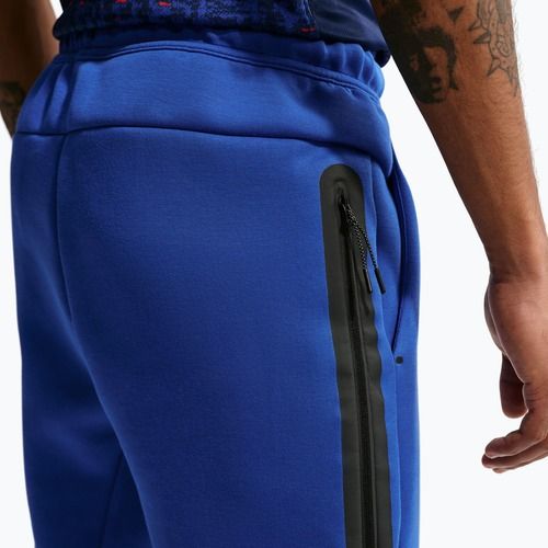 Pantaloncini da calcio da uomo Nike FFF Tech Fleece Joggers game royal/metallic copper