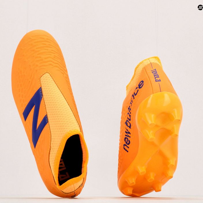 Scarpe da calcio per bambini New Balance Tekela V3+ Magique JNR FG impulso/arancio vibrante 10