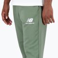 Pantaloni New Balance Essentials Stacked Logo verde da uomo 5