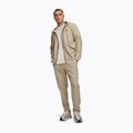 Pantaloni da allenamento da uomo Under Armour Unstoppable Tapered Pants city khaki/black 2