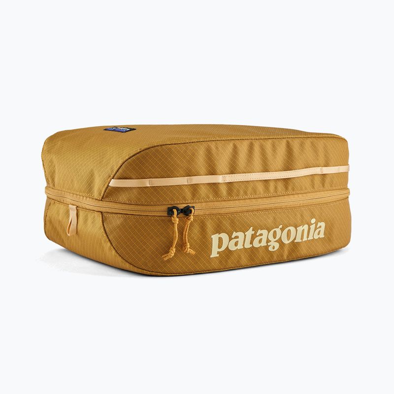 Patagonia Black Hole Cube pufferfish oro con borsa cosmetica in cera d'api