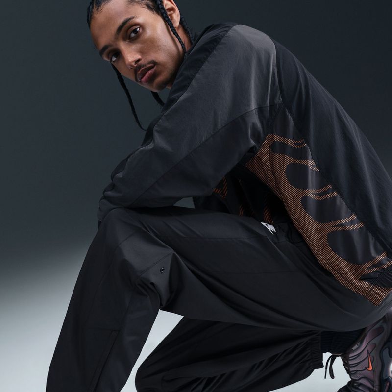 Pantaloni uomo Nike Windrunner Lined black/white 9