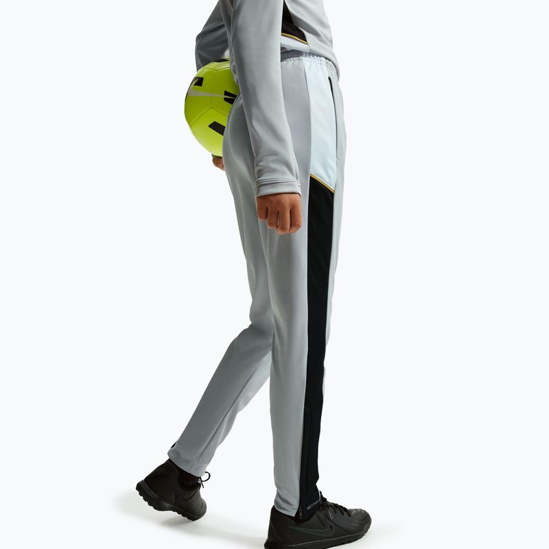 Pantaloni da bambino Nike Academy Dri-Fit Jr light smoke grey/white/black/metallic gold 6