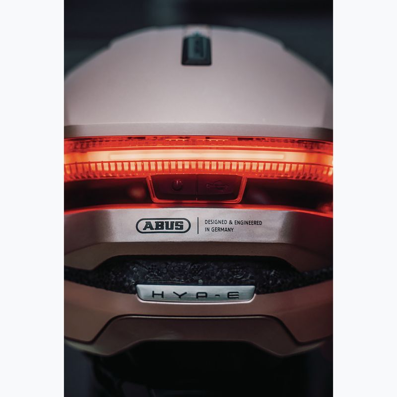 Casco da bici con indicatori di direzione ABUS Hyp-E champagne gold 9