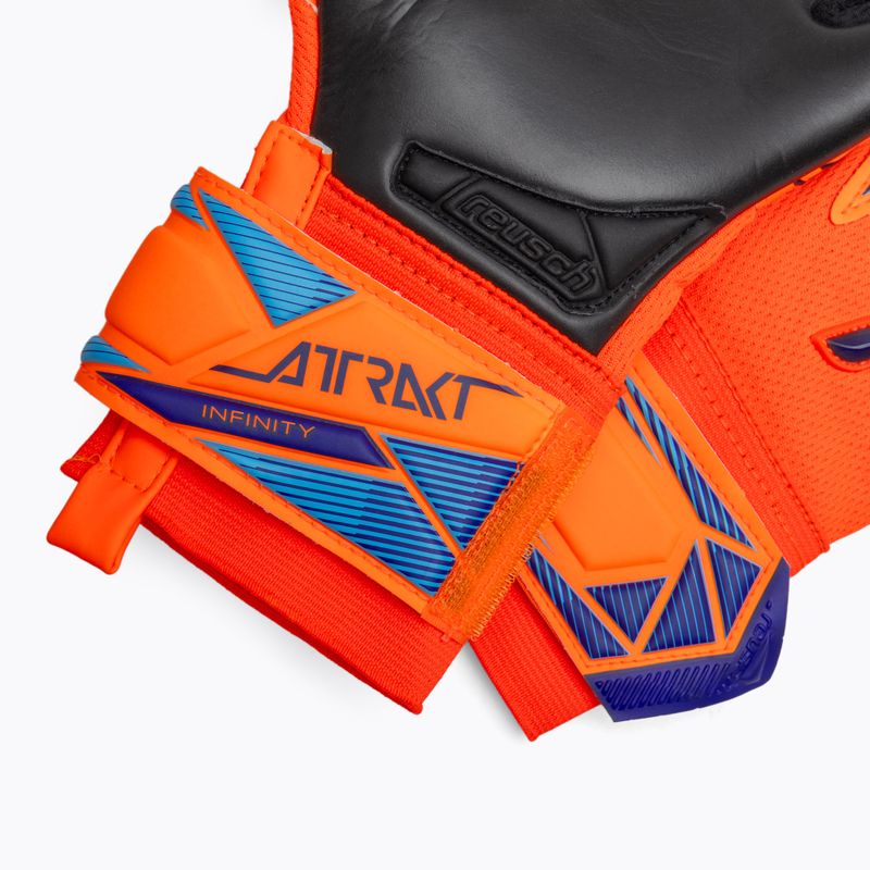 Guanti da portiere per bambini Reusch Attrakt Infinity Evolution NC Junior shocking orange/blue/black 5
