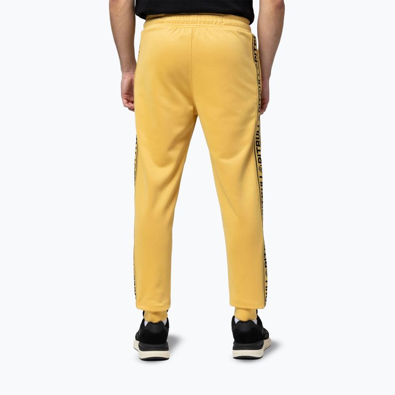 Pantaloni uomo Pitbull Trackpants Tape Logo Terry Group pale yellow 3