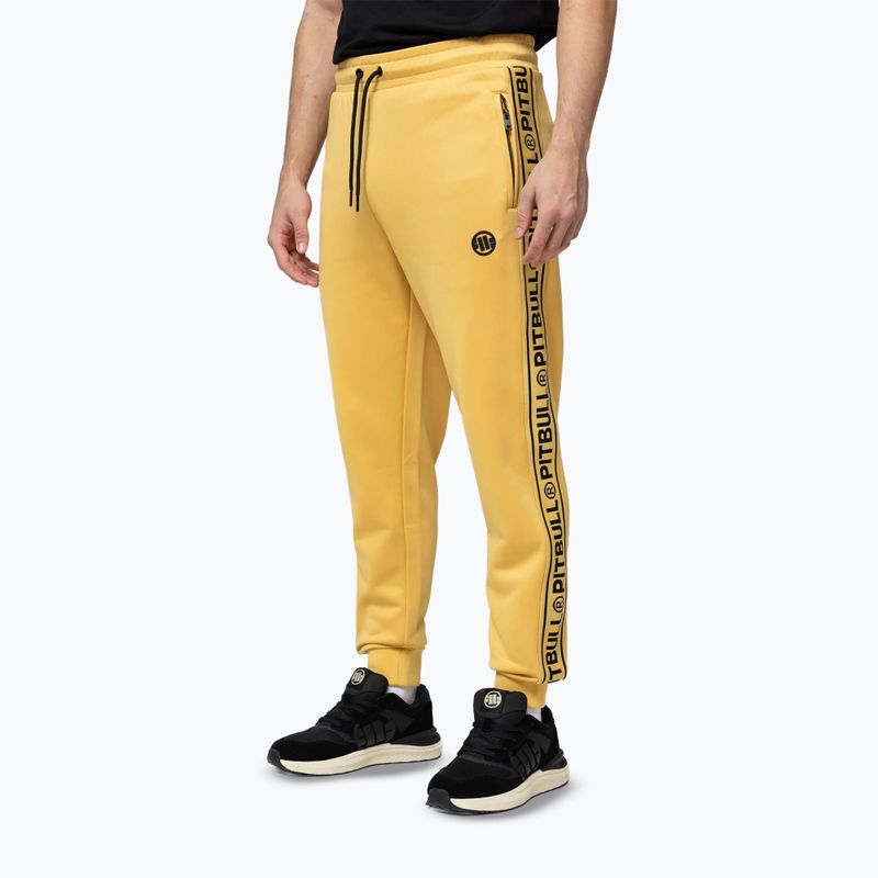 Pantaloni uomo Pitbull Trackpants Tape Logo Terry Group pale yellow 4