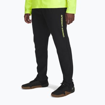 Pantaloni da corsa Under Armour Storm Run da uomo nero / giallo alta visibilità / riflettente